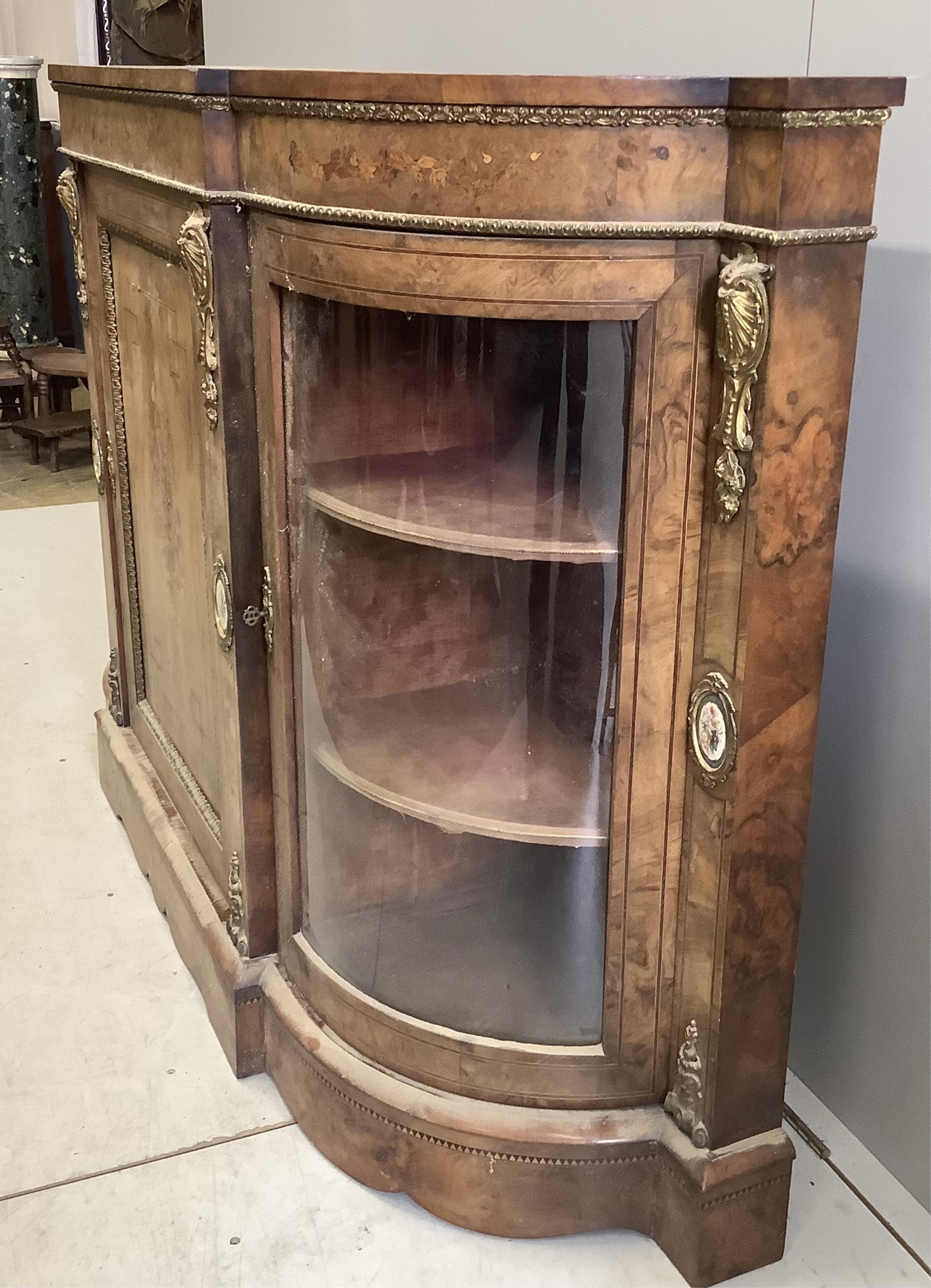 A Victorian marquetry inlaid, gilt metal mounted bowfront side cabinet
